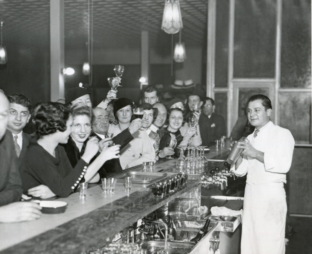 prohibition era image of people at a bar celebrating the end of prohibition